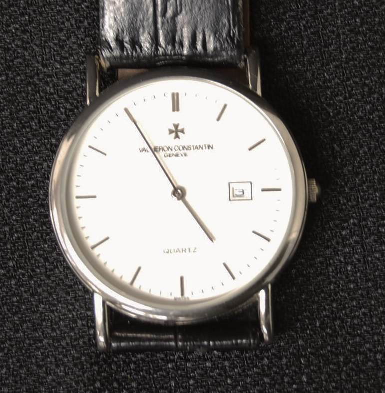 095: VACHERON CONSTANTIN OVERSEAS QUARTZ CLOCK: VACHERON QUARTZ WATCH WITH GENUINE LEATHER BAND.