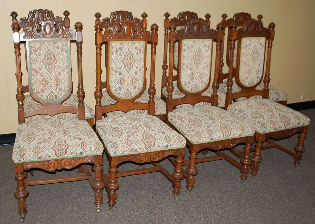 060: SET OF EIGHT LION HEAD CARVED DINING CHAIRS: OPPOSING LION HEAD CREST CA 1880, 21"W, 21"D, 45"TALL