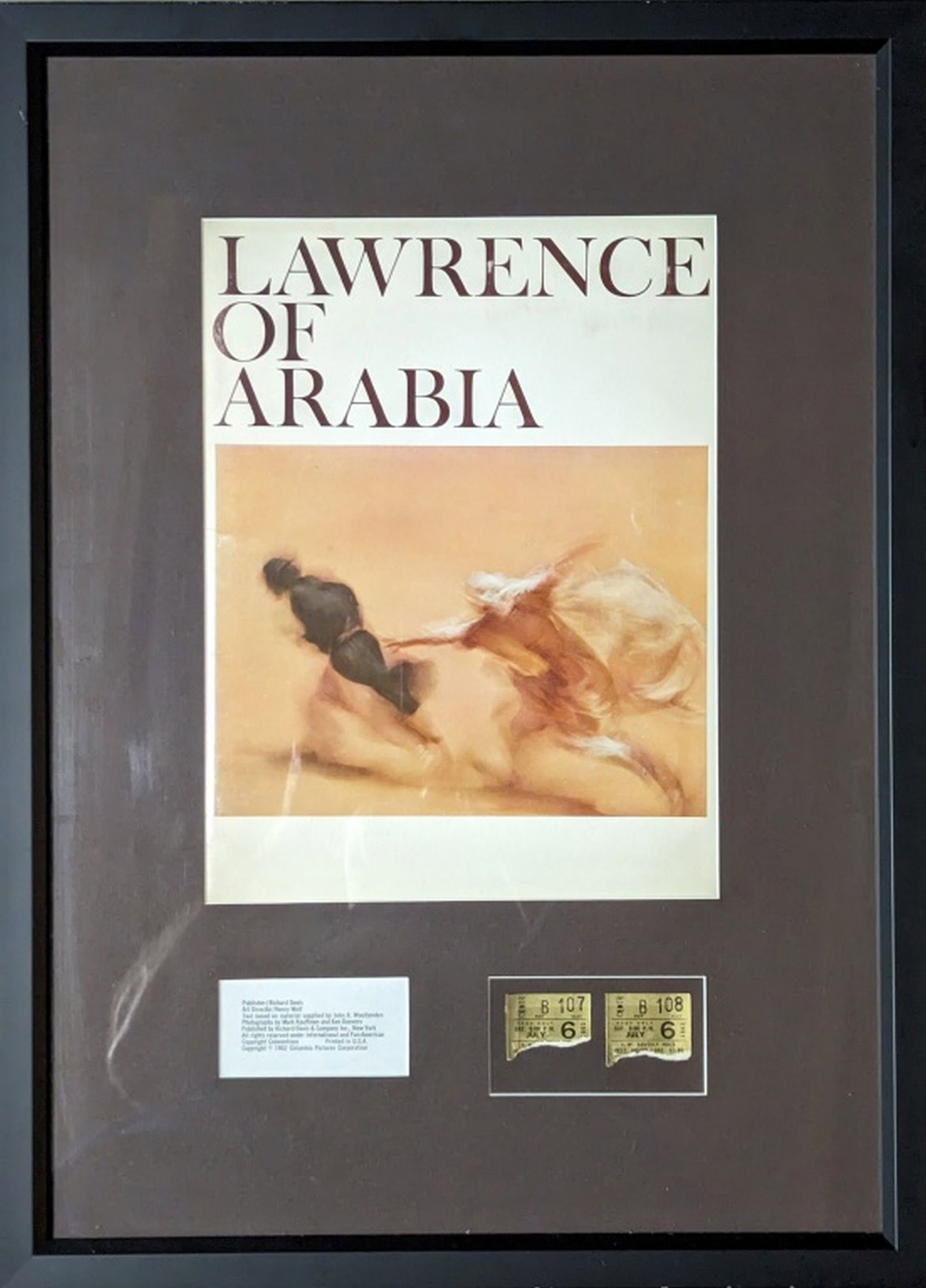 Lawrence of Arabia Opening Night Ticket Stubs: Original ticket stubs from Lawrence of Arabia, July 6, 1963 in Beverly Hills! Frame: 23.5 x 16.5 in. Lawrence of Arabia is a 1962 epic biographical adventure drama film based on the life of T. E. Lawr
