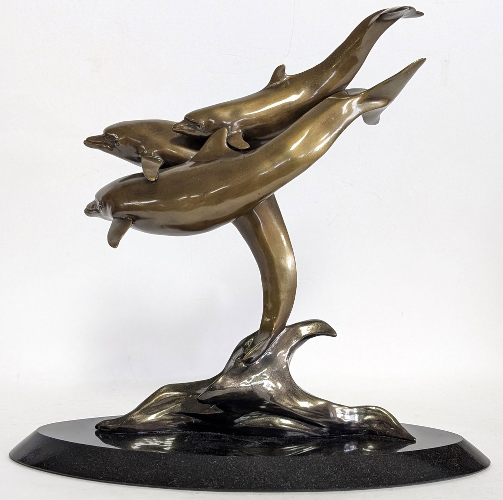 Renee Headings Bronze Dolphins Sculpture 16.75"W: Renee Headings (American 1958 - ). Amazing action filled bronze of Dolphins playing and swimming together. Absolutely Beautiful! 15.5H x 16.75W x 7D in. Signed in the bronze on the base Renee Headings