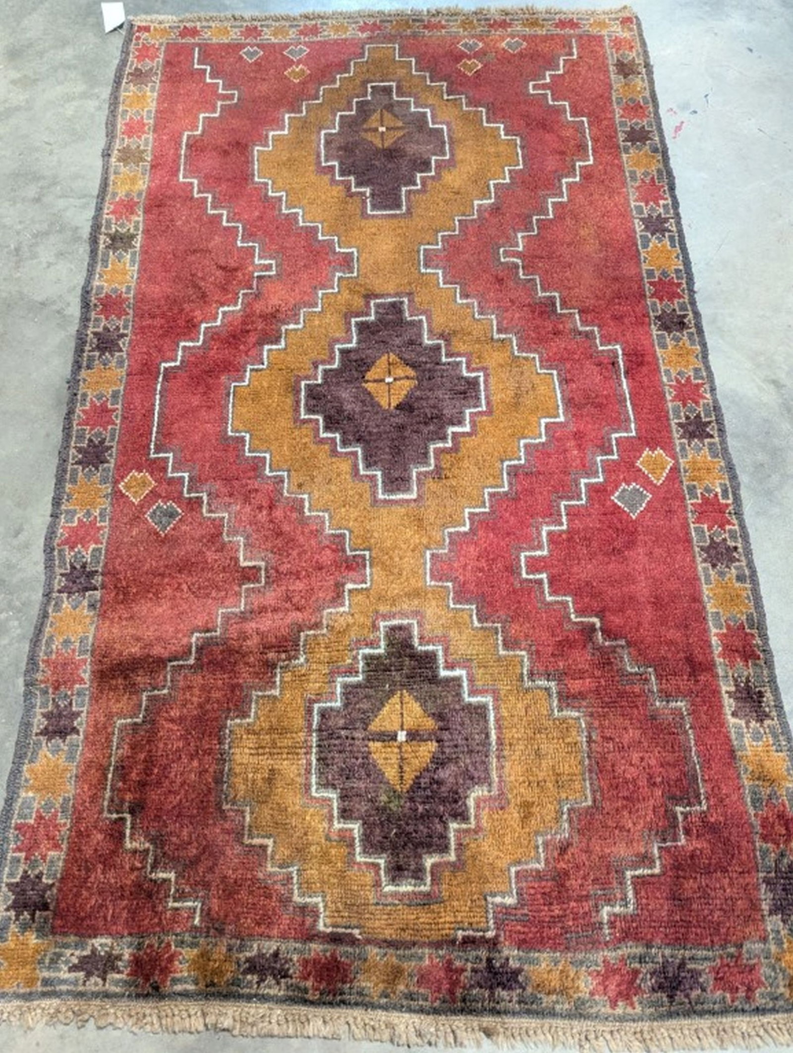 Kazak Hand Knotted Rug 3.9 x 6.7 ft: Beautiful Hand Knotted Rug! 3.9 x 6.7 ft. Retail 1000. Semi-antique 20 - 50 years old. In good condition and ready to use. May have some wear. We consider the photos to be the condition report. Please