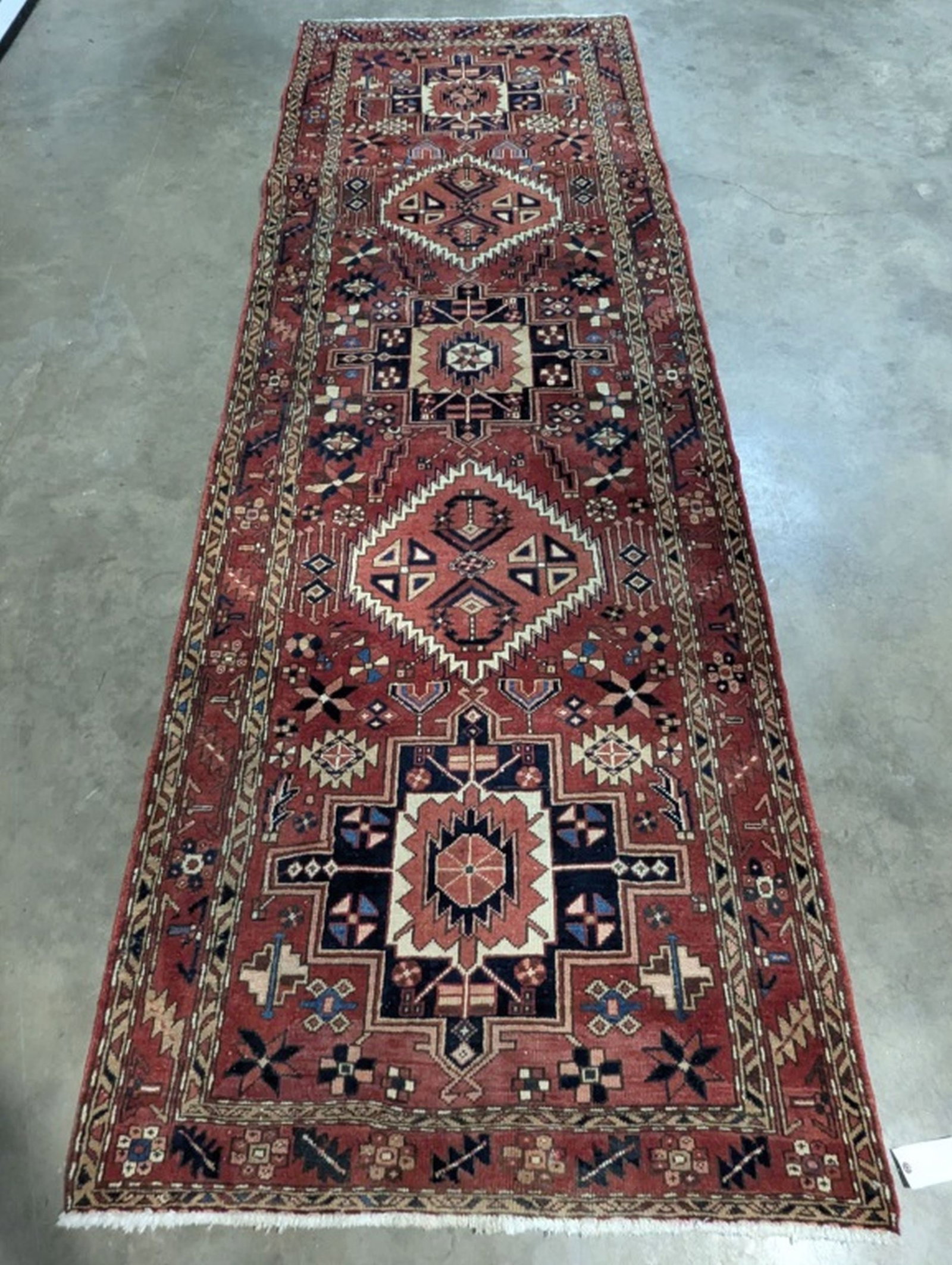 Heriz Hand Knotted Runner Rug 3.9 x 11 ft: Beautiful Hand Knotted Rug! 3.9 x 11 ft. Retail 1500. Semi-antique 20 - 50 years old. In good condition and ready to use. May have some wear. We consider the photos to be the condition report. Please 