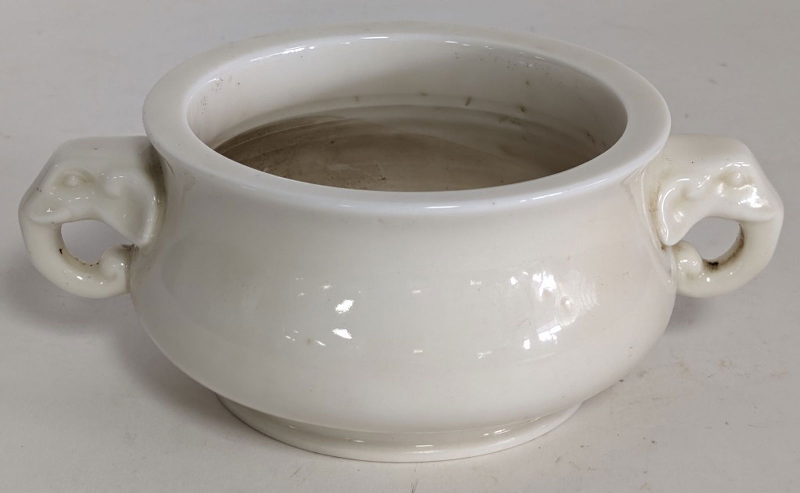 19thc Chinese Blanc de Chine Censer 7.5W": Chinese Blanc de Chine porcelain incense burner or censer with elephant head handles. Blanc de Chine is the French term for the distinctive white porcelain made in Dehua, Fujian province, China. 3H x