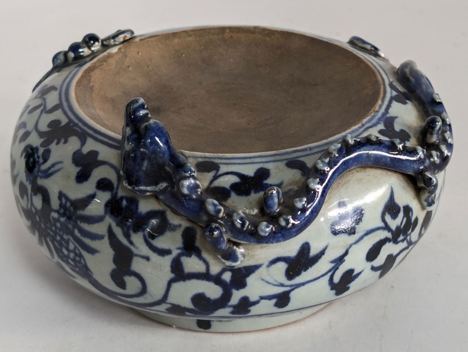 Antique Chinese Blue & White Porcelain Censer 7"W: Chinese blue and white porcelain incense burner with applied dragon motif, possibly from the Yuan dynasty. 4H x 8W in. It features traditional blue and white underglaze painting, a technique that beca