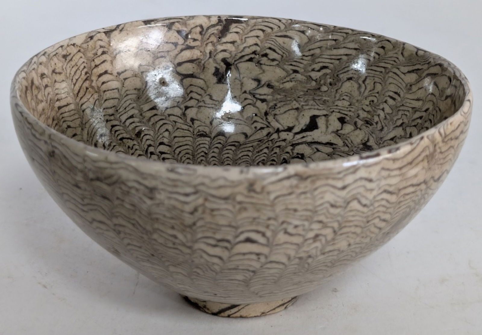 Antique Chinese Marbled-Clay Bowl 5"D: Very fine Chinese marbled-clay bowl, known as jiao tai or jiao ni (mixed clay), from the Northern Song dynasty. 2.5H x 5W in. The decorative technique involves kneading together dark and light-colored