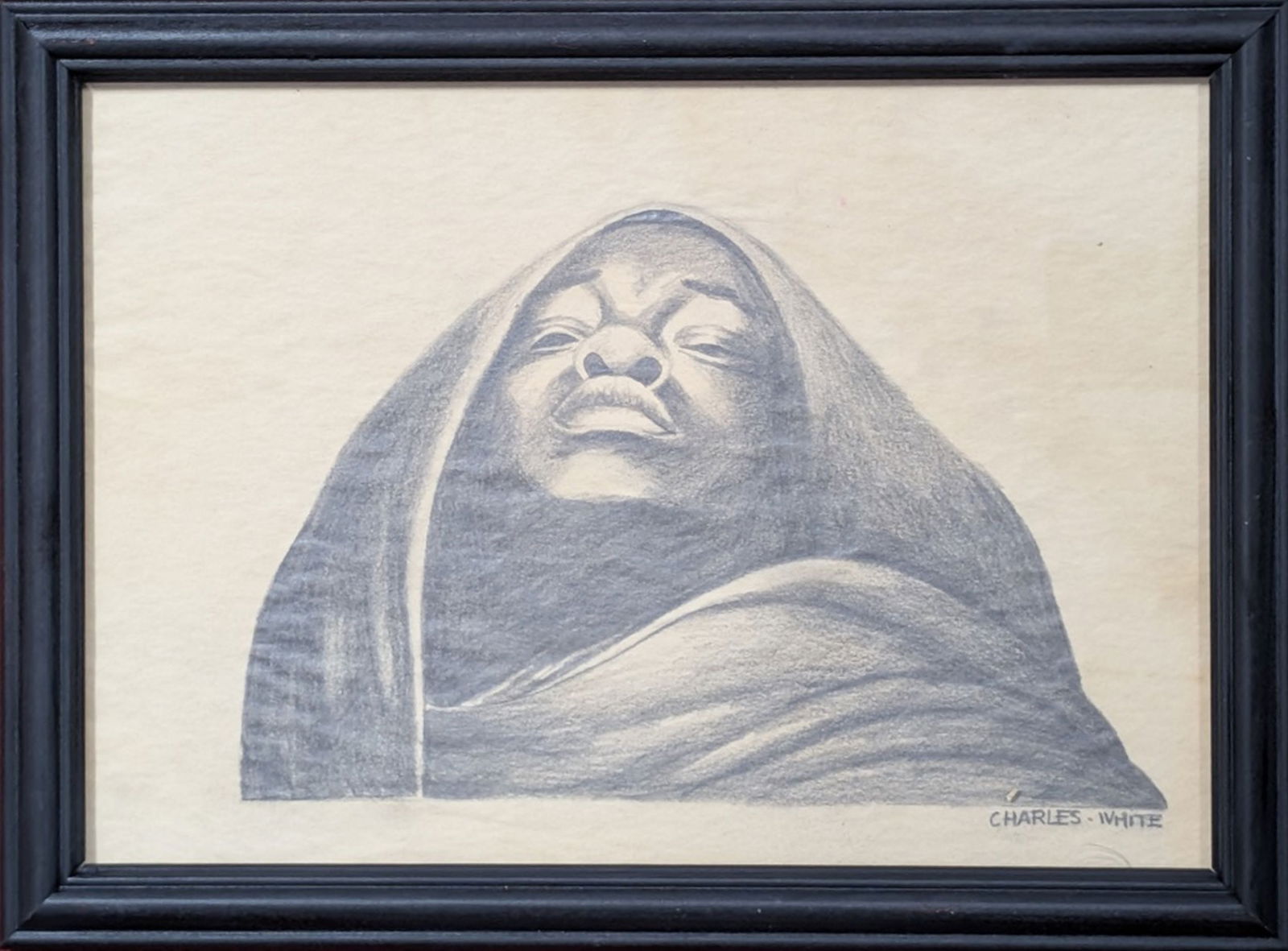 Original "Hooded Man" Signed Charles White: Intense and original charcoal on paper signed Charles White. Condition: Very good overall appearance. Size: 8.5 x 11.5 in. Frame: 10 x 13 in. Charles Wilbert White, Jr. was an American artist known fo