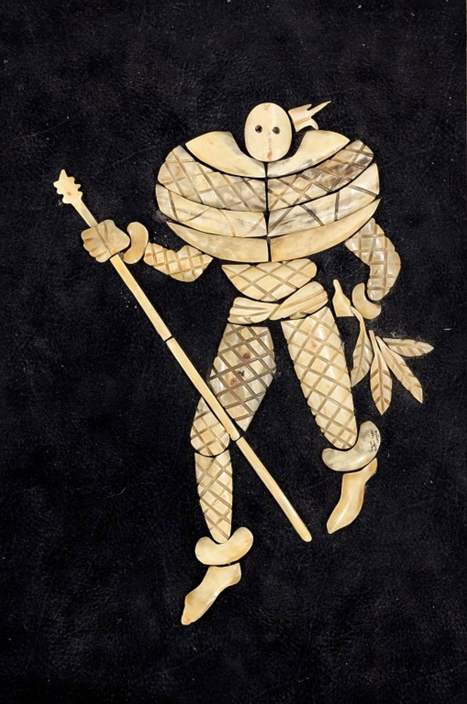 Toyin, Nigerian Folk Art Bone Inlay Sculpture: This is a unique Nigerian bone inlay artwork depicting a stylized ceremonial figure, handcrafted from individually carved pieces of natural bone arranged against a deep burgundy velvet background. The