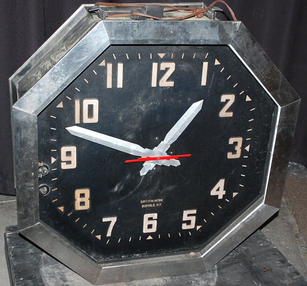 SAY IT IN NEON DOUBLE SIDED STREET CLOCK: FROM THE WILSON ESTATE, FROM BUFFALO NEW YORK, 33"DIAMETER, 12" DEEP