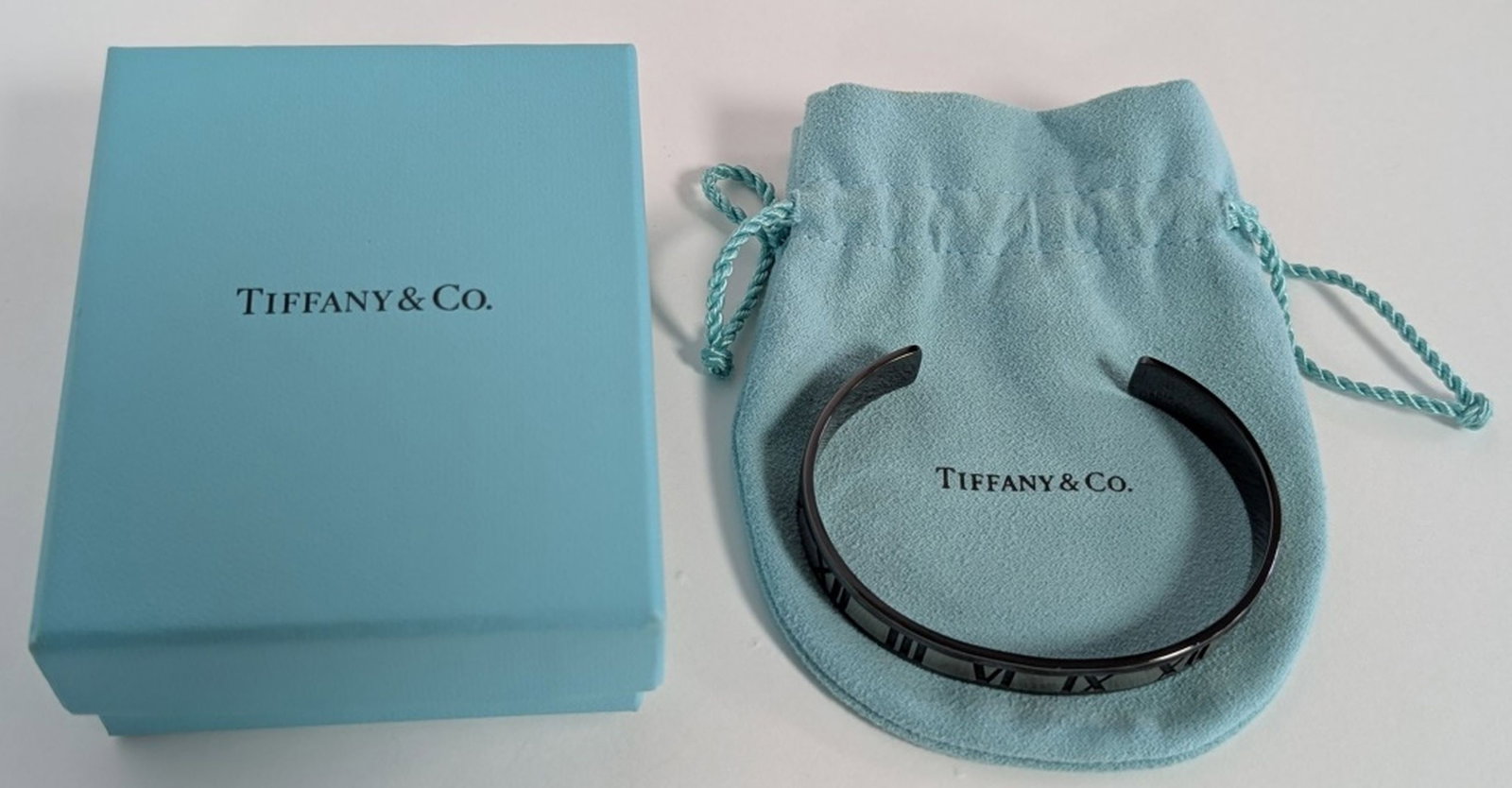 Tiffany & Co. Atlas Titanium & Silver Bracelet: Tiffany & Co. Atlas Titanium and Sterling Silver Cuff Bracelet. Stylish and contemporary, this Tiffany & Co. Atlas cuff bracelet is crafted in a striking combination of titanium and sterling silver, f