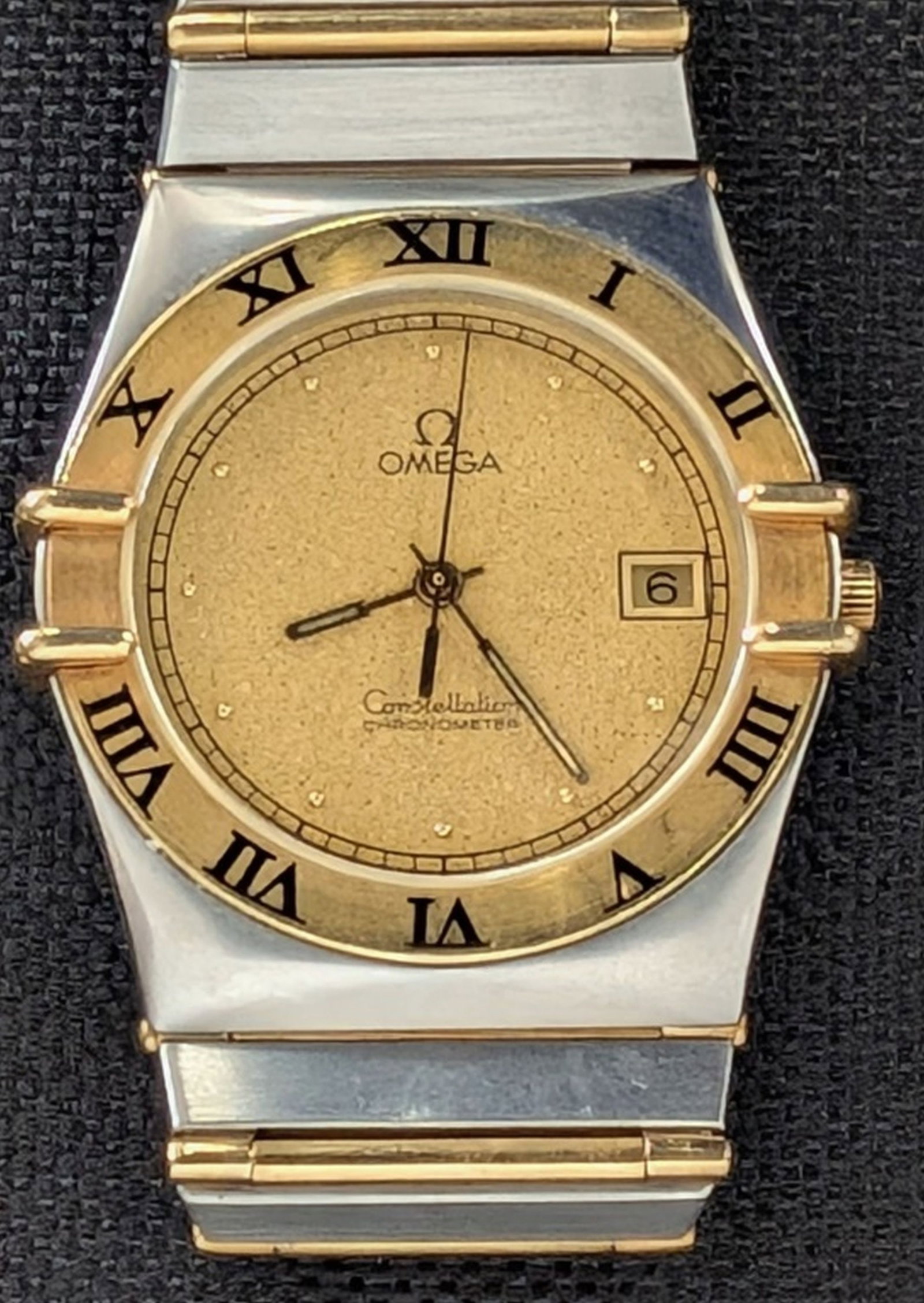 Omega Constellation Chronometer Wristwatch: Omega Constellation Chronometer Wristwatch. Elegant Omega Constellation stainless steel and gold-tone quartz chronometer wristwatch, featuring the iconic Constellation Manhattan case design with integ