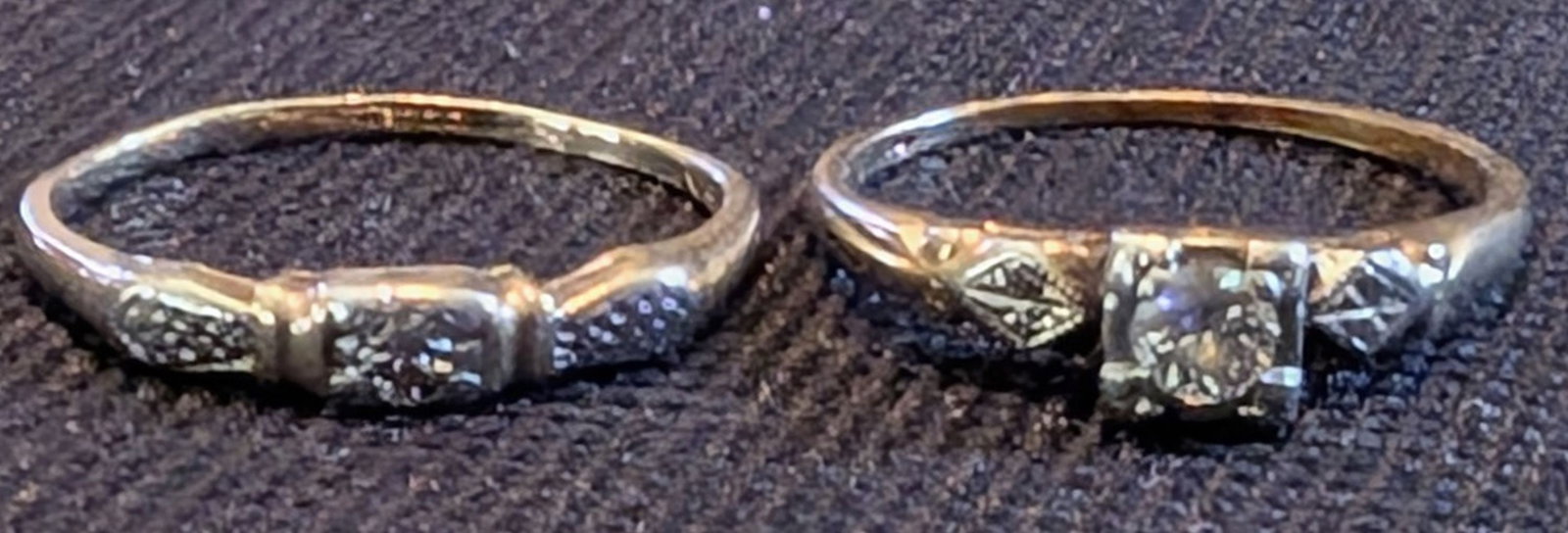 Pair of Vintage 14K Gold Diamond Rings: Offered as a pair, this group includes two vintage 14K yellow gold diamond rings of differing designs. The first is a delicate diamond engagement-style ring set with a round brilliant-cut diamond meas