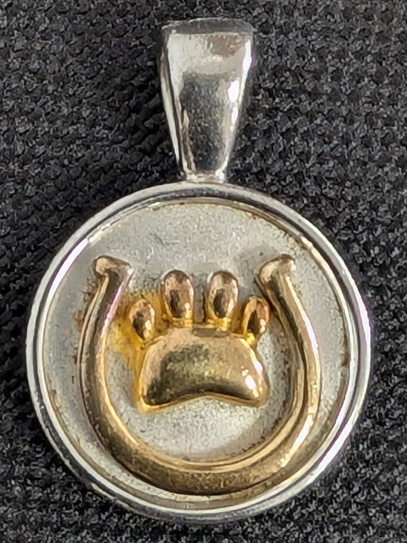 Sterling Silver / 18K Horseshoe, Dog Paw Pendant: Lisa Welch Designs Sterling Silver and 18K Gold Horseshoe & Dog Paw Pendant. A charming equestrian and canine-themed pendant by Lisa Welch Designs, crafted in sterling silver with 18K gold accents. Th