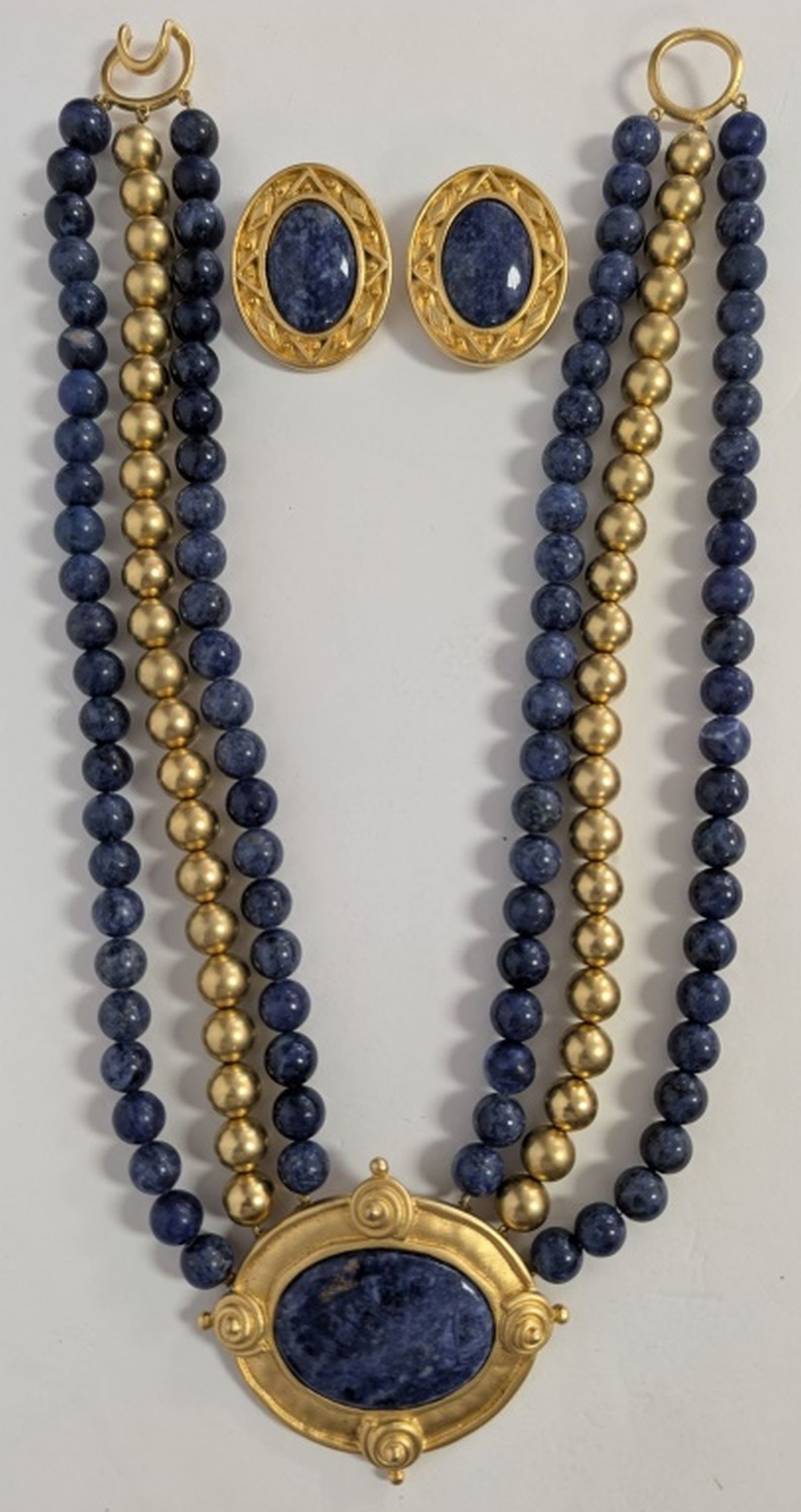 Leslie Block Necklace and Earrings: Leslie Block Blue Stone & Gilt Metal Necklace and Earrings. Contemporary Leslie Block designer jewelry ensemble comprising a dramatic triple-strand necklace with polished blue stone beads and satin gi