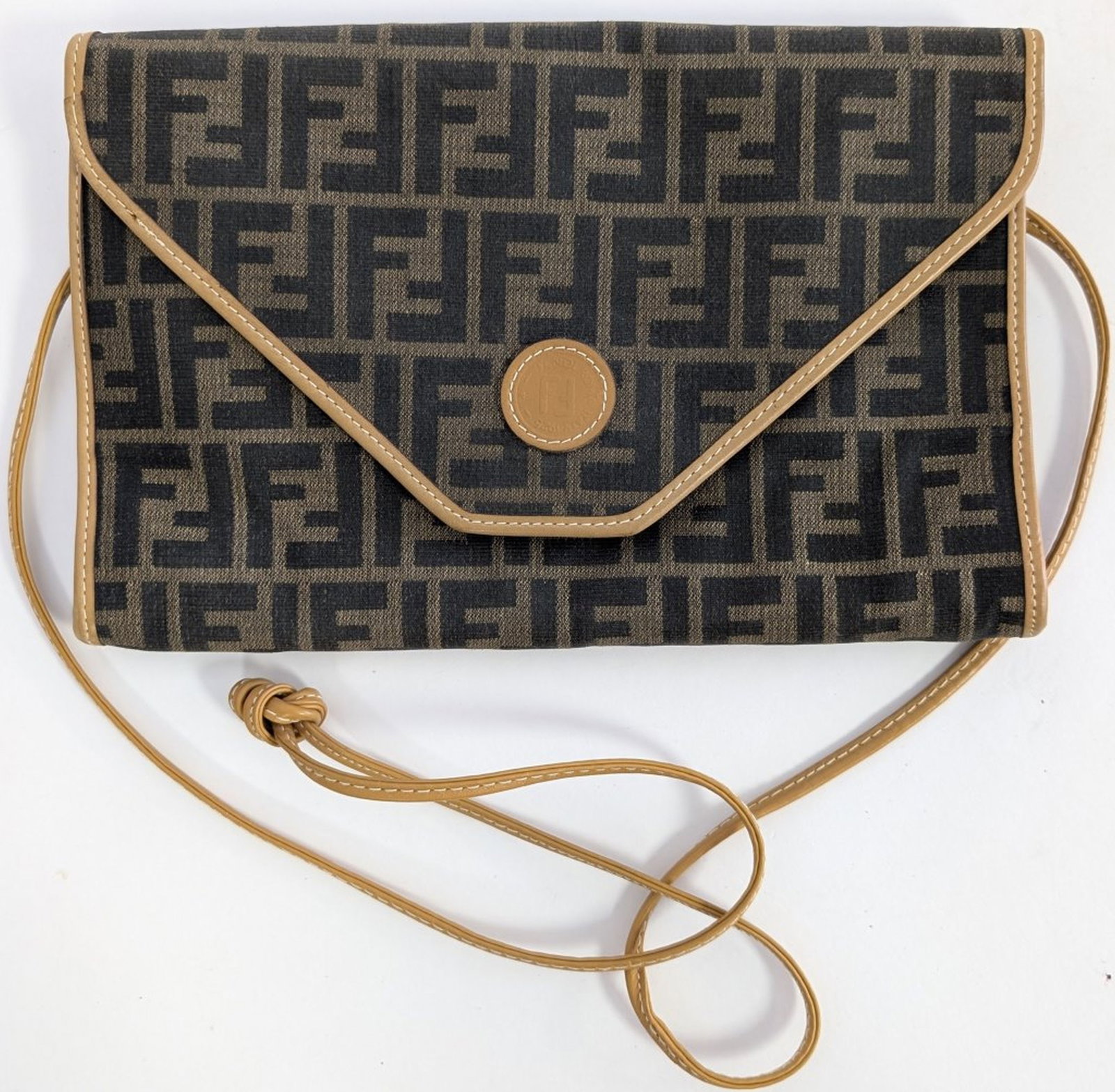 Vintage Fendi Zucca Envelope Crossbody Bag: Italian-made vintage Fendi envelope-style crossbody bag featuring the iconic brown and black Zucca FF monogram coated canvas with tan leather trim, front flap with embossed FF medallion, magnetic snap