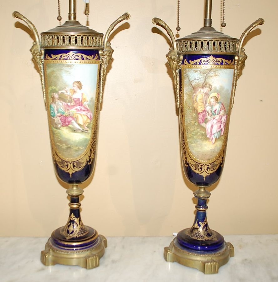 PAIR OF PORCELAIN SEVRES STYLE VASES: FROM THE GARRARD ESTATE. CONVERTED TO LAMPS, 9"DIAMETER, 20"TAll plus lamp harps