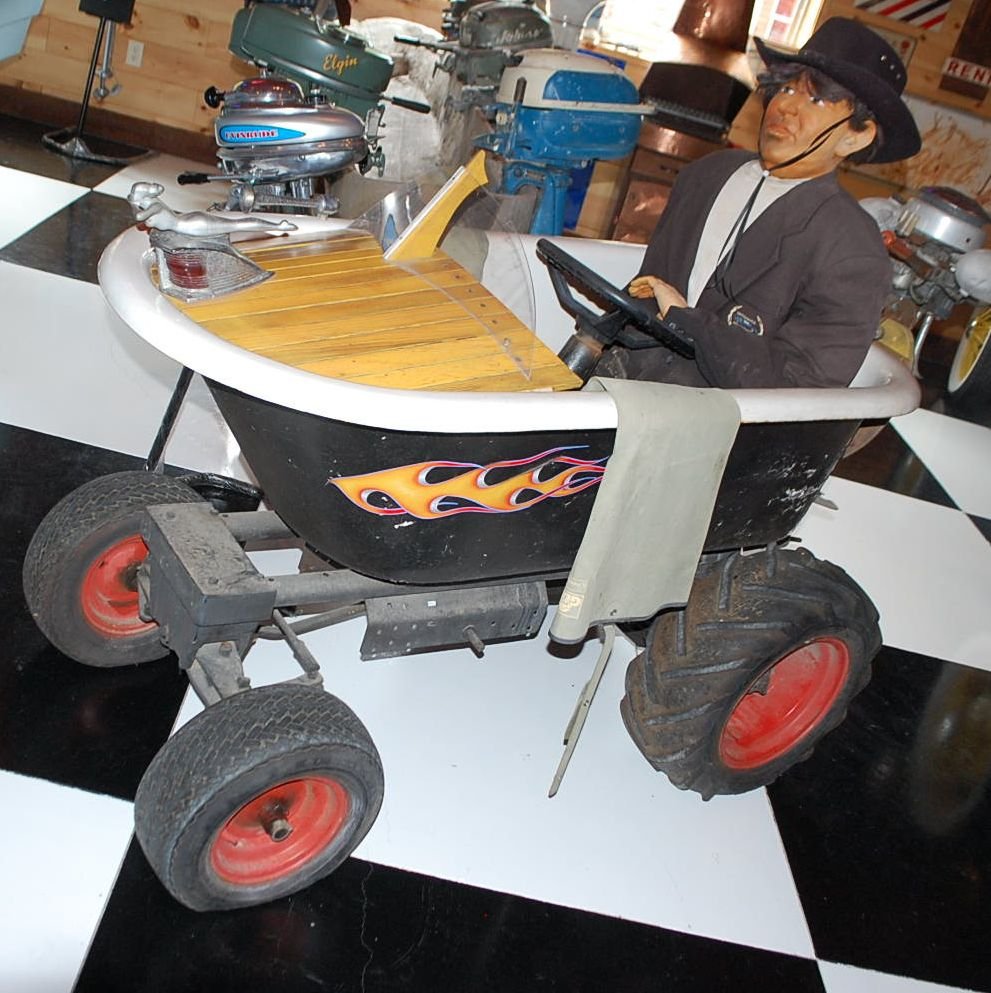BATHTUB BOAT ON WHEELS FOLK ART: USED,WITH BOAT MOTOR, MANNEQUIN NOT INCLUDED