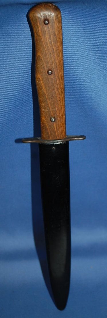 NAZI BOOT KNIFE: WOOD HANDLE. POLISHED BLADE. TOTAL LENGTH SHEATHED IS 11 1/2 INCHES