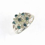 1.25 ctw Blue & White Diamond Ring: * 1.25 ctw of Genuine Brilliant Round Cut Diamonds * Clarity: Promotional * Color: Blue & White * Natural White Diamonds * Irradiated Color Enhanced Blue Diamonds * 100% Genuine Diamonds * Metal Type: