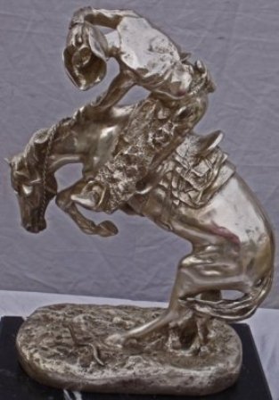 REMINGTON "SET OF 4 VERY RARE SILVER EDITION: This grouping is made up of 5 signed and numbered limited edition silver patina bronze statues by Remington. VERY RARE...MINT "Bronco Buster" 22" H, 16" W, 8.5" D "Buffalo Horse" 26" H, 18.5" W, 10" D