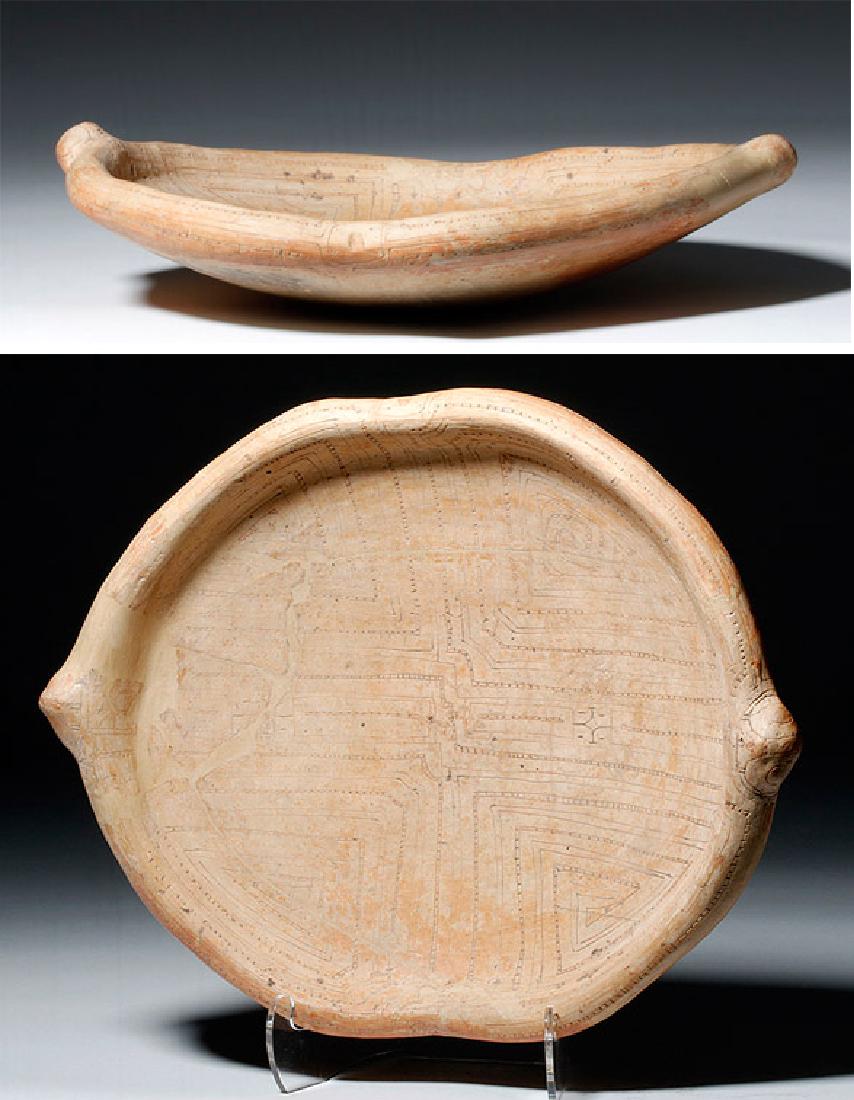 Ancient Brazilian Marajoara Pottery Dish: Pre-Columbian, Lower Amazon Basin, Marajo Island, Brazil, ca. 400 to 1350 CE. A lovely hand-built ceramic dish decorated in a buff colored slip over an intricate, incised geometric design on both the