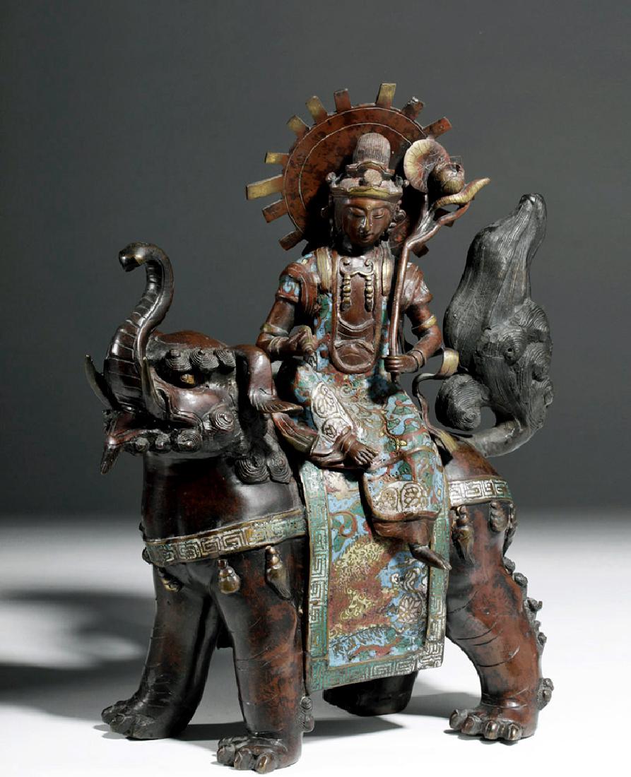 18th C. Tokugawa Japanese Bronze Champlevé Bodhisattva: East Asia, Japan, Tokugawa Shogunate, ca. 18th century CE. A champlevé, bronze, shakudo bodhisattva figure, cast in the round, seated on an elephant-lion animal figure. The entity appears to be a com