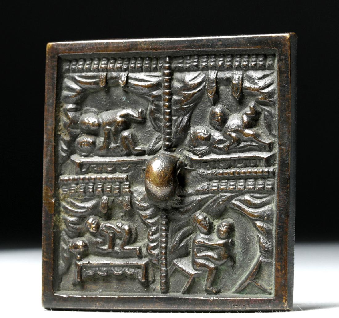 Chinese Ming Dynasty Bronze Mirror w/ Erotic Scenes: China, Ming Dynasty, 1368 to 1644 CE, probably later in the period. A cast bronze mirror with a decorated side divided into four panels, each depicting an erotic scene. In the center of the decorated 