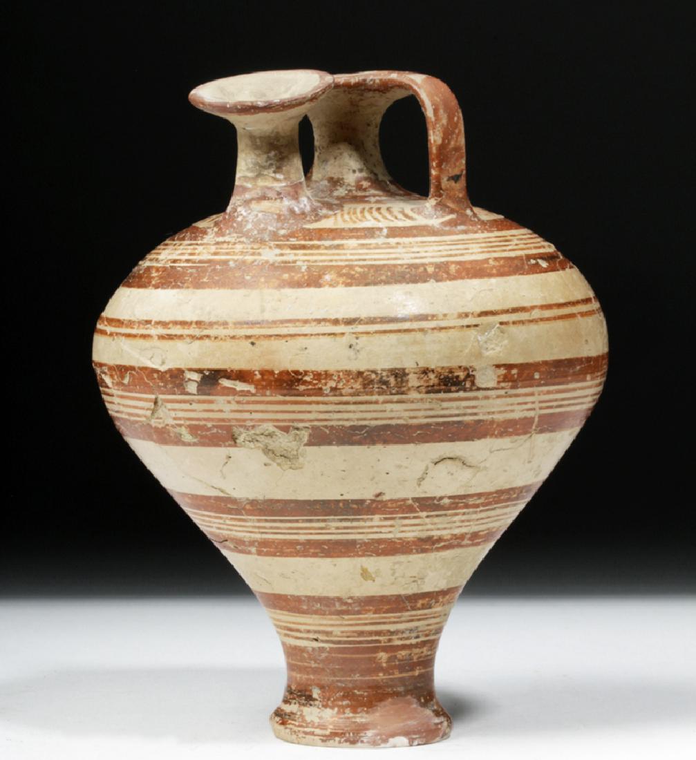 Greek Mycenaean Pottery Piriform Jar: Greece, Mycenaean Period, Late Bronze Age II, ca. 1450 to 1200 BCE. A piriform jar, representing some of the earliest mass production of ceramic items in world history. With a diminutive foot and a bo