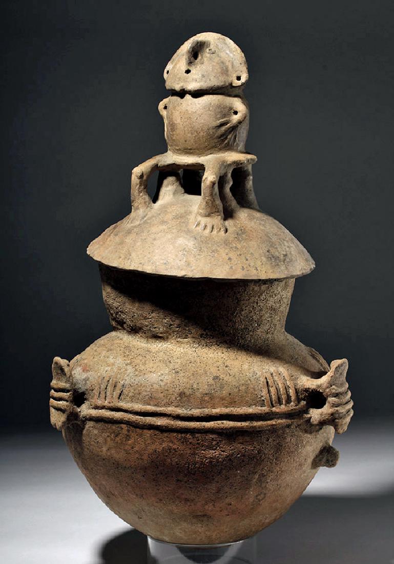 Huge Rio Magdalena Pottery Two-Piece Funerary Urn: Pre-Columbian, Northern Colombia, Rio Magdalena, ca. 800 to 1500 CE. A lidded, coiled and hand-built terracotta vessel used for the interment of the elite deceased. The bulbous base is decorated with 