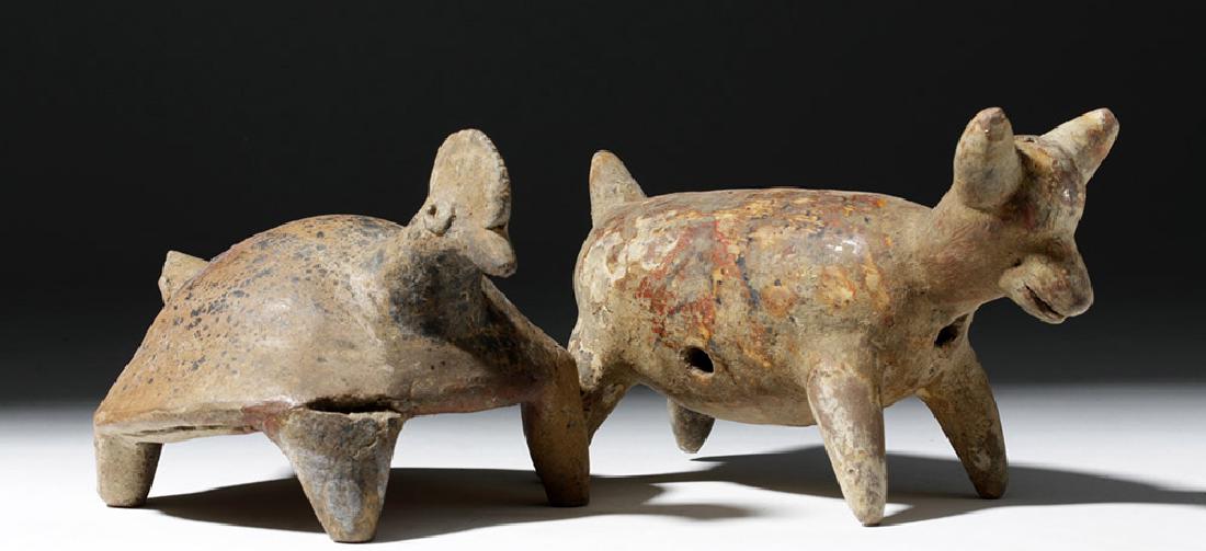 Pair of Nayarit Pottery Animal Forms: Pre-Columbian, West Mexico, Nayarit, ca. 300 BCE to 300 CE. Two adorable terracotta animals from this shaft tomb culture. First, a dog standing on all fours, his head with a long snout, pointy ears, a