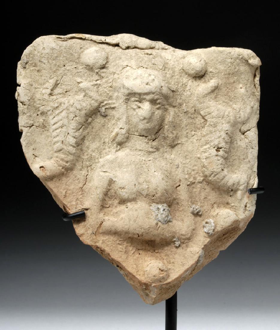 Near-Eastern Terracotta Plaque of Goddess & Scorpions: Ancient Near East, modern day Syria, ca. 3rd millennium BCE. A mold-pressed terracotta plaque depicting an ancient deity, probably Ishara who first appeared in Ebla and was part of the Hurrian pantheo