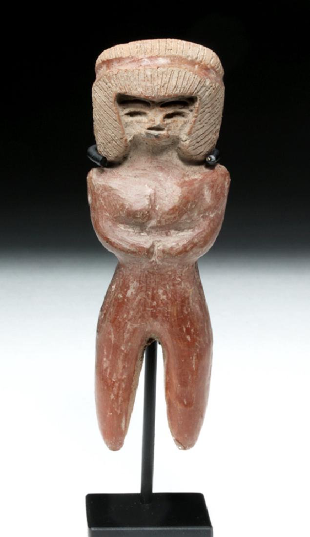 Valdivian Pottery Venus Figure - Excellent Condition: Pre-Columbian, Ecuador, Valdivian culture, ca. 3500 BCE. A reddish ceramic figure of a woman. She has a stylized head, with thin slits for eyes, eyebrows, and mouth, and a low relief nose. Her face is