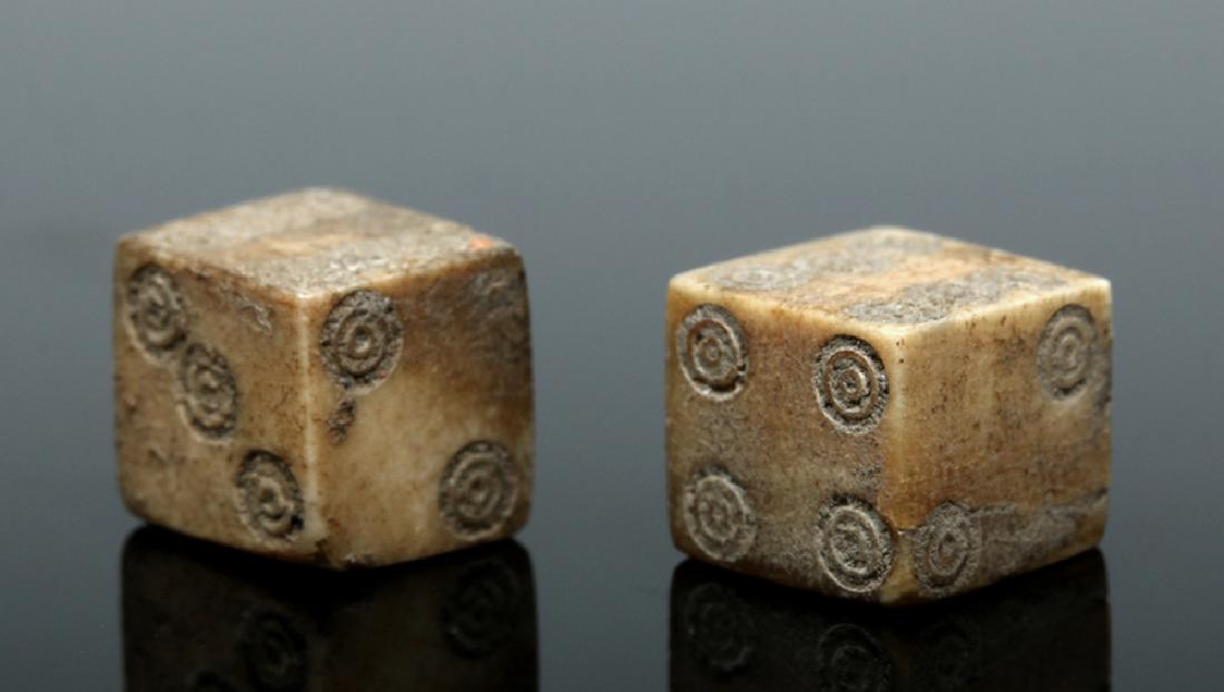 Pair of Roman Bone Dice: Roman Empire, Imperial Period, ca. 1st to 4th century CE. An excellent and functional set of six-sided dice, carved from ancient bovine bone, with each die displaying one through six. These seemingly