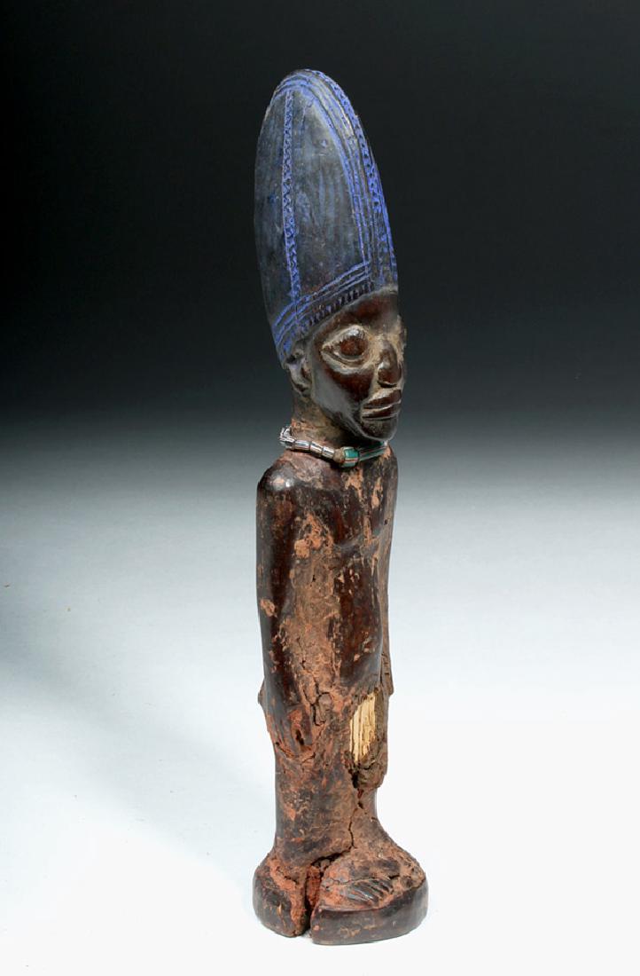 Early 20th C. African Ibeji Wooden Twin Figure: **First Time At Auction** West Africa, Nigeria, Yoruba peoples, ca. early 20th century CE. A male Ere Ibeji twin figure, hand carved to represent a deceased twin, standing with his hands placed upon h