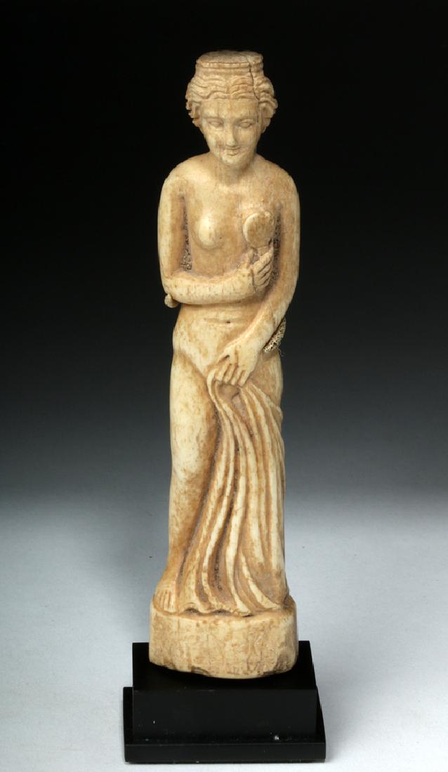Beautiful Roman Bone Statuette of Venus: Rome, Imperial Period, ca. 1st to 3rd century CE. A miniature sculpture depicting Venus (Greek Aphrodite) - the Olympian goddess of beauty, love, pleasure, sexual rapture, and fertility - finely carve