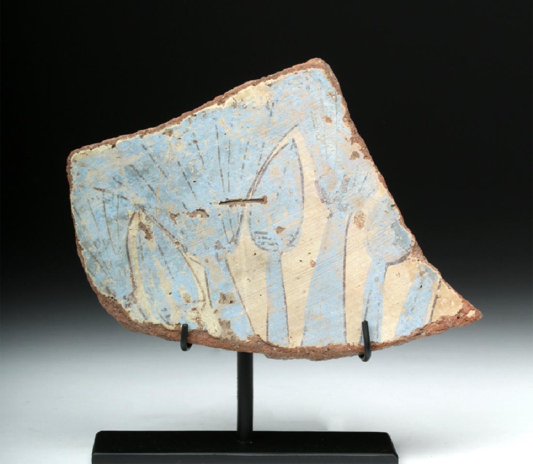 Rare Egyptian Amarna Pottery Fragment: Ancient Egypt, Amarna Period, ca. 1352 to 1336 BCE. A curved piece of pottery, probably a fragment from the side of a large vessel, with a motif of a lotus and palmettes on a gorgeous blue background,