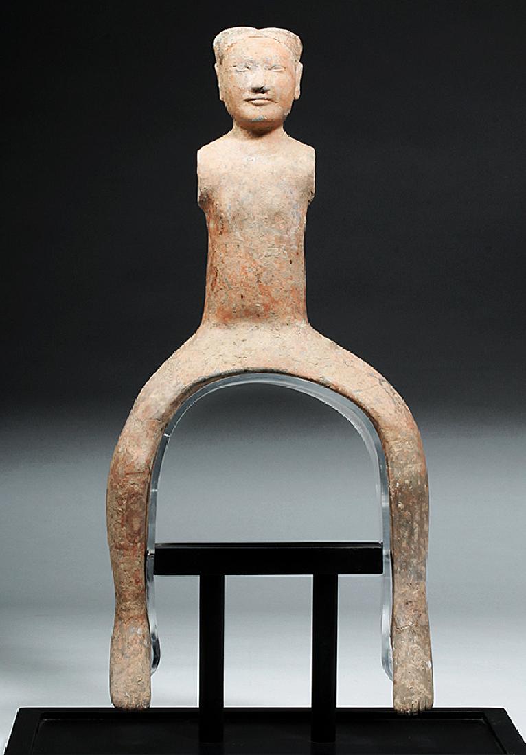 Han Dynasty Pottery Horse Rider: China, Han Dynasty, ca. 206 BCE to 220 CE. Large and rare pottery equestrian molded to fit the body of a very large and wide horse. His legs are exaggeratedly long with long, thin, bare feet, thin bod