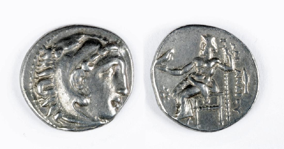 Silver Drachm of Alexander The Great: Kings of Macedon, , Alexander the Great, 336 to 323 BCE, AR drachm , 4.1 grams. OBVERSE: Head of Herakles right, wearing lion skin. REVERSE: A?E?AN?POY, Zeus seated left with eagle and sceptre, 6 glob