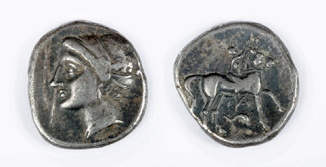 Silver Didrachm from Tarentum - Calabria: Italy, Calabria, Tarentum, 280 to 150 BCE, AR didrachm, 6.96 grams. OBVERSE: Head of a nymph l., wearing Sphendone and triple-pendant earring. REVERSE: Youth, nude, seated on horse standing r., holdin