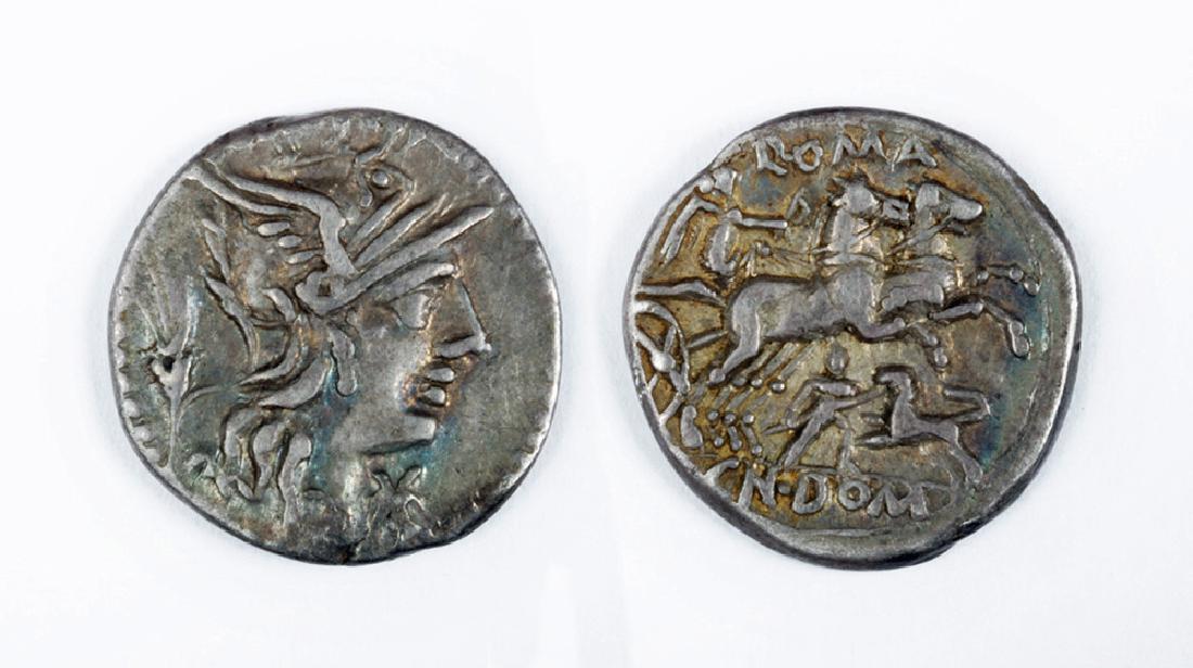 Republican Silver Denarius of Cn. Domitius Ahenobarbus: Cn. Domitius Ahenobarbus, 128 BCE, AR denarius, 3.9 grams, Rome Mint OBVERSE: Helmeted head of Roma r., wheat ear behind, mark of value before. REVERSE: Victory in biga r., holding whip; below, man fi