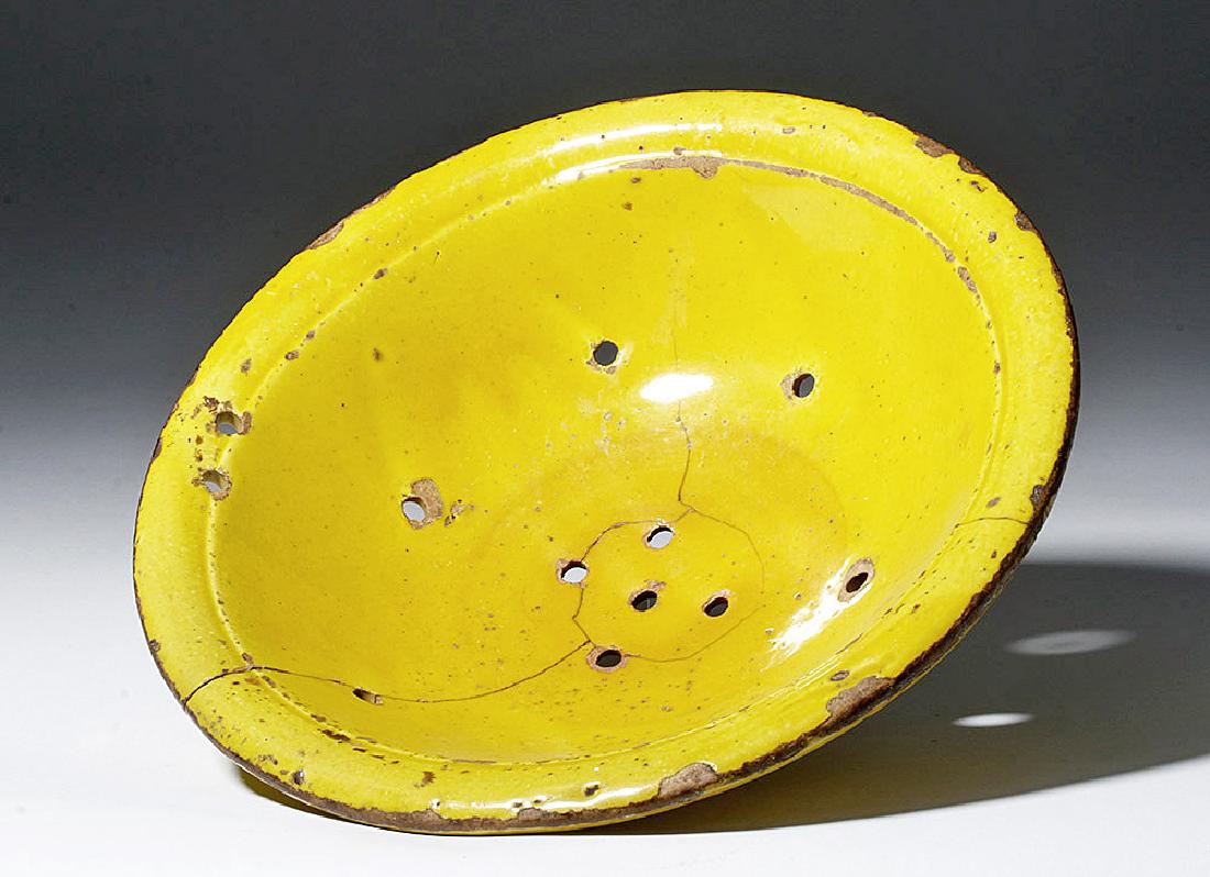 Rare 19th C. Spanish Yellow Glazed Strainer Bowl: **Originally Listed At $100** Europe, Spain, ca. mid to late 19th century CE. An antique, yellow-glazed Spanish terracotta strainer, hand thrown, perforated, and decorated with a rich and lustrous sun