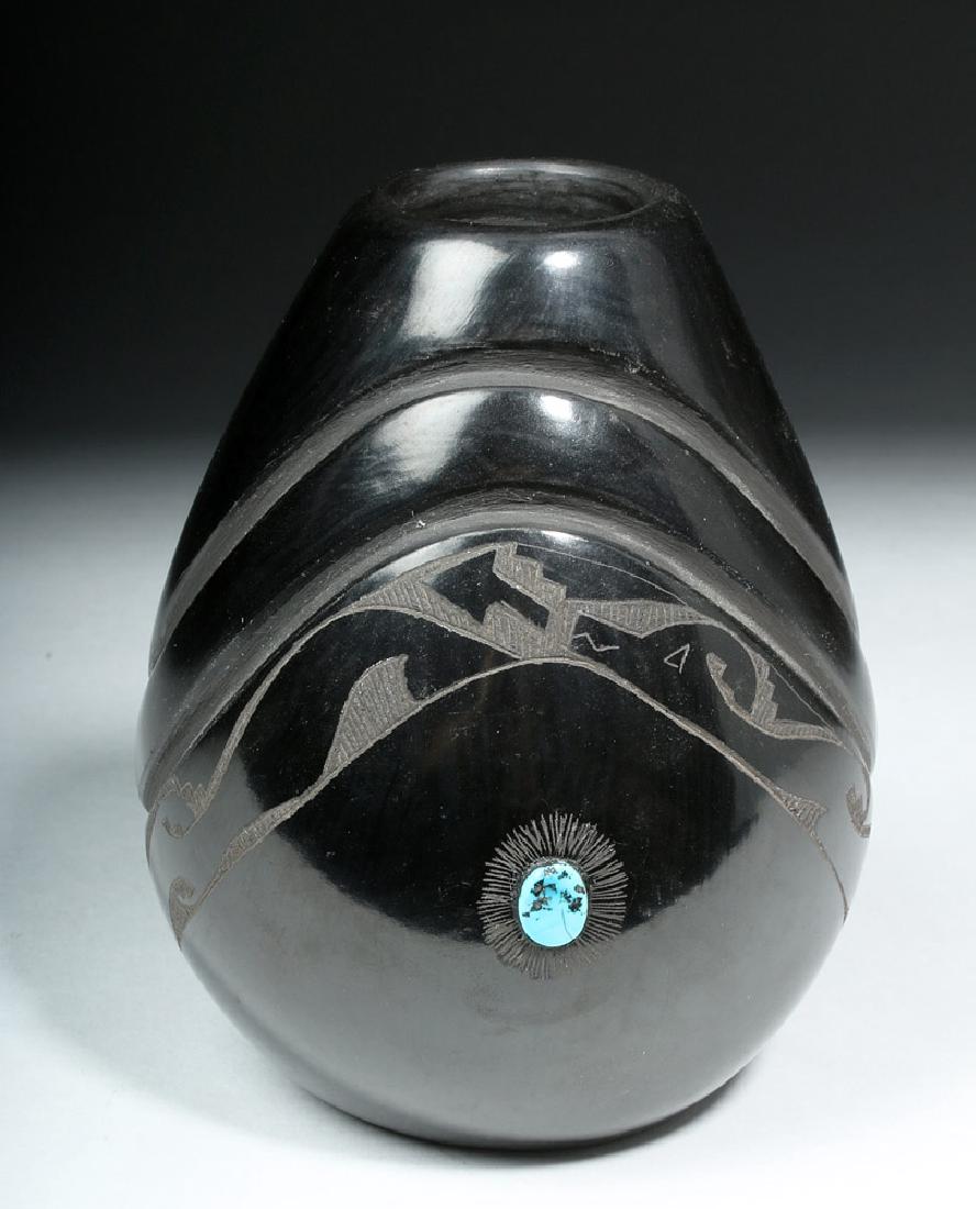 Santa Clara Native American Pottery Jar, Melvin Moquino: New World, Native American, New Mexico, Santa Clara Pueblo, Melvin Moquino (b. 1966), ca. late 20th century CE. An elegant teardrop shaped black-on-black vessel featuring two gently rising registers w
