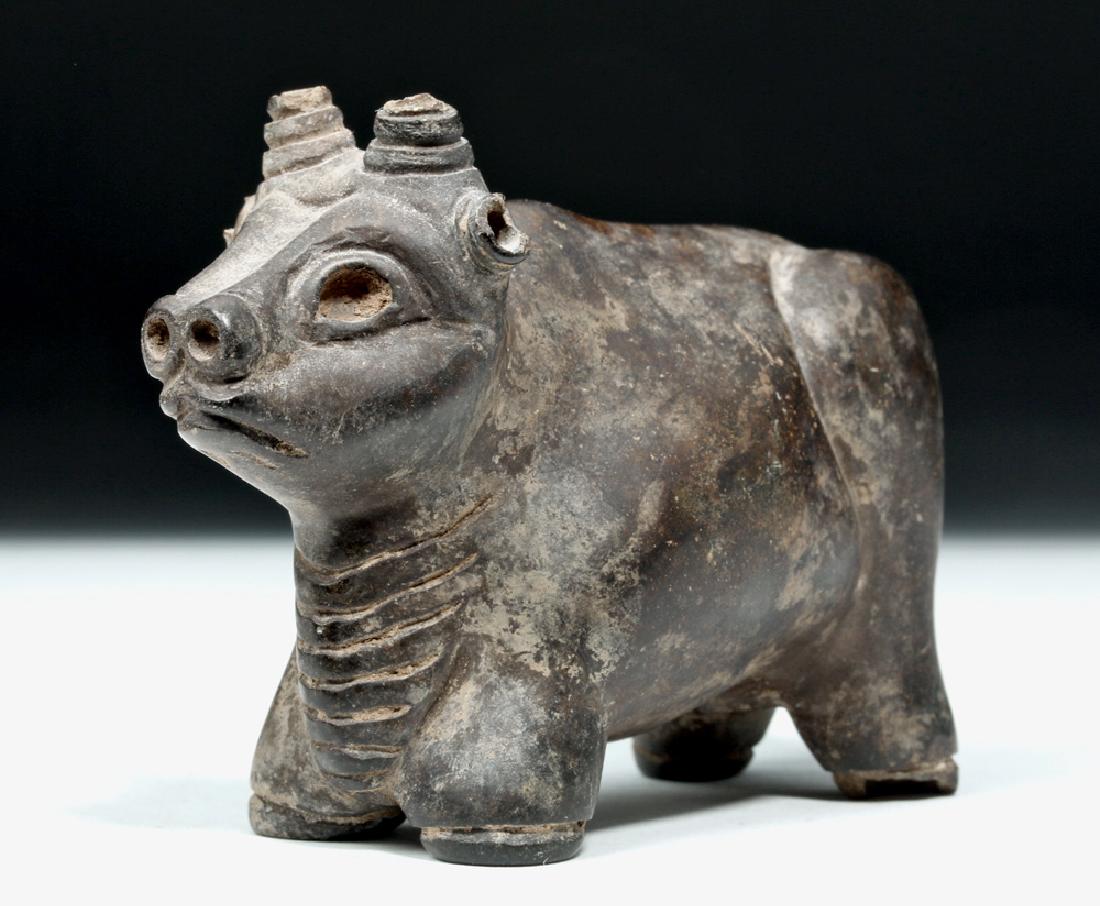 Mesopotamian / Sumerian Carved Stone Bull: Mesopotamia, Sumerian, ca. 3000 to 2000 BCE. A finely carved stone bull with meticulously delineated twisted horns with openings presumably for inserting bone ornaments, bold facial features including