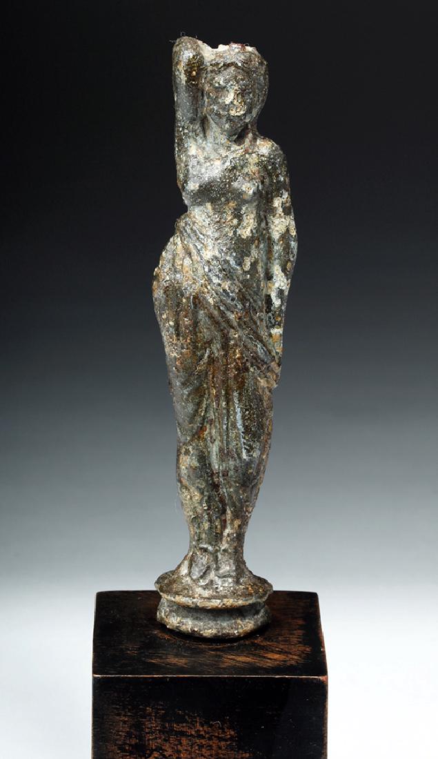 Roman Imperial Bronze Venus Statuette: **Originally Listed At $400** Roman, Imperial Period, ca. 1st to 3rd century CE. A sensually-posed cast bronze figure of a standing Venus, shown mostly nude aside from a himation that is draped around