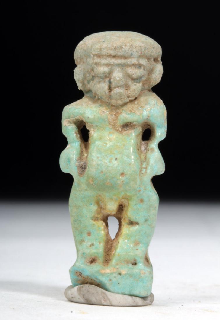 Egyptian Faience Amulet of Pataikos: Egypt, Late Dynastic period, dynasty 26 through 30, ca. 662 to 320 BCE. Very fine faience amulet - worn for good luck or often included in the mummy wrappings for good luck in the afterlife. Amulet in