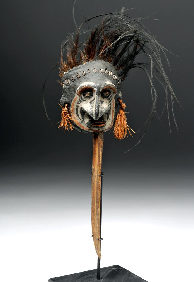 Rare Papua New Guinea Bone, Feather & Mud Spirit Dagger: Oceania, Papua New Guinea, East Sepik, probably Abelam, ca. early 20th century CE. A fascinating object, a "spirit dagger" made from a long cassowary bone fashioned into a weapon. The dagger is capped
