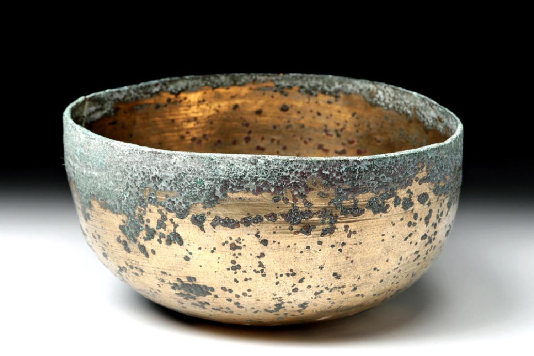 Stunning Sasanian Gilded Bronze Bowl: Ancient Near East / Central Asia, Sasanian (Sassanian / Sassanid) Empire, ca. 2nd to 7th century CE. A beautiful example of a gilded bronze bowl with the exterior base decorated with a lightly incised