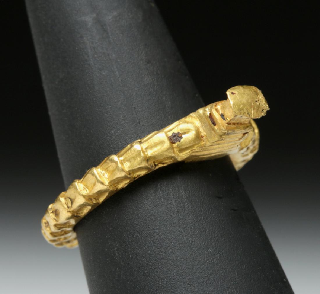 Byzantine 22K Gold Ring - 8.5 grams: Near East / Holy Land, Byzantine Empire, ca. 9th to early 13th century CE. An interesting 22K gold ring, composed of a heavy round band with a projection that calls to mind a tower or other architectu