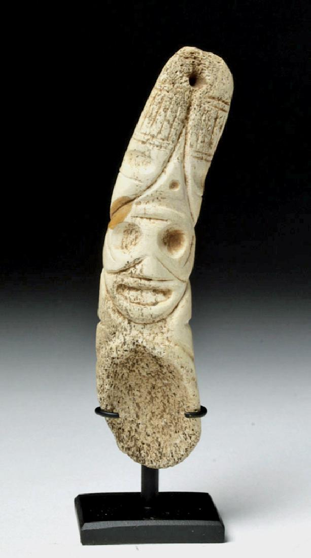Pre-Columbian Taino Bone Drug Spoon w/ Zemi: Pre-Columbian, Caribbean area, Hispaniola, Arawak Taino Indians, ca. 1200 to 1500 CE. Finely carved from manatee bone, a spoon with a handle depicting a zemi face comprised of large concave eyes, an i