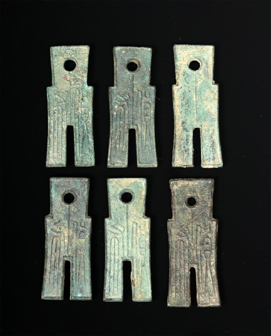 Lot of 6 Chinese Han Dynasty Bronze Huo-pu Coinage: **First Time At Auction** East Asia, China, Han Dynasty, ca. 14 CE to 220 CE. A group of six cast bronze huo-pu, or spade coins, each well cast and of uniform size, emphasizing the centralized control
