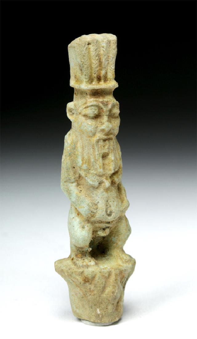 Egyptian Faience Amulet - Bes on Palm: **Originally Listed At $300** Ancient Egypt, Third Intermediate Period or later, ca. 1000 to 332 BCE. A relatively large faience mold-made amulet depicting the god Bes perched on a palm tree, nude asi
